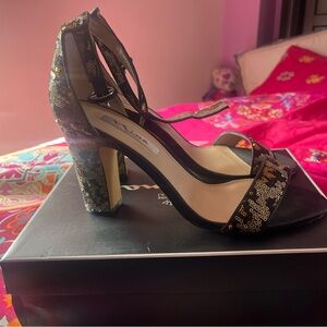 Black and gold sequence Nina brand heels.